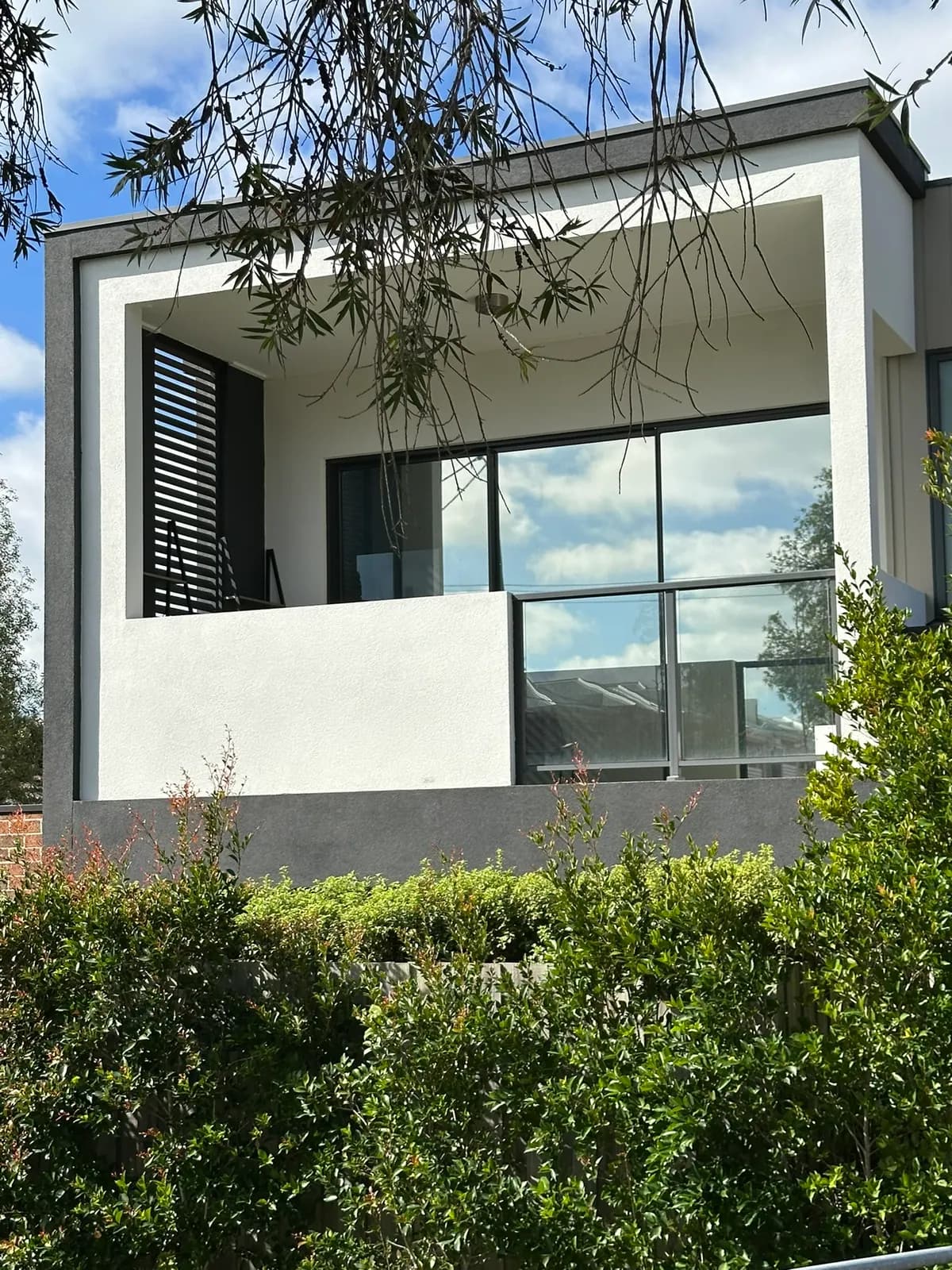 Premium mirror window film installed throughout this modern apartment, providing exceptional daytime privacy and heat reduction while maintaining natural light and a sleek, reflective finish.