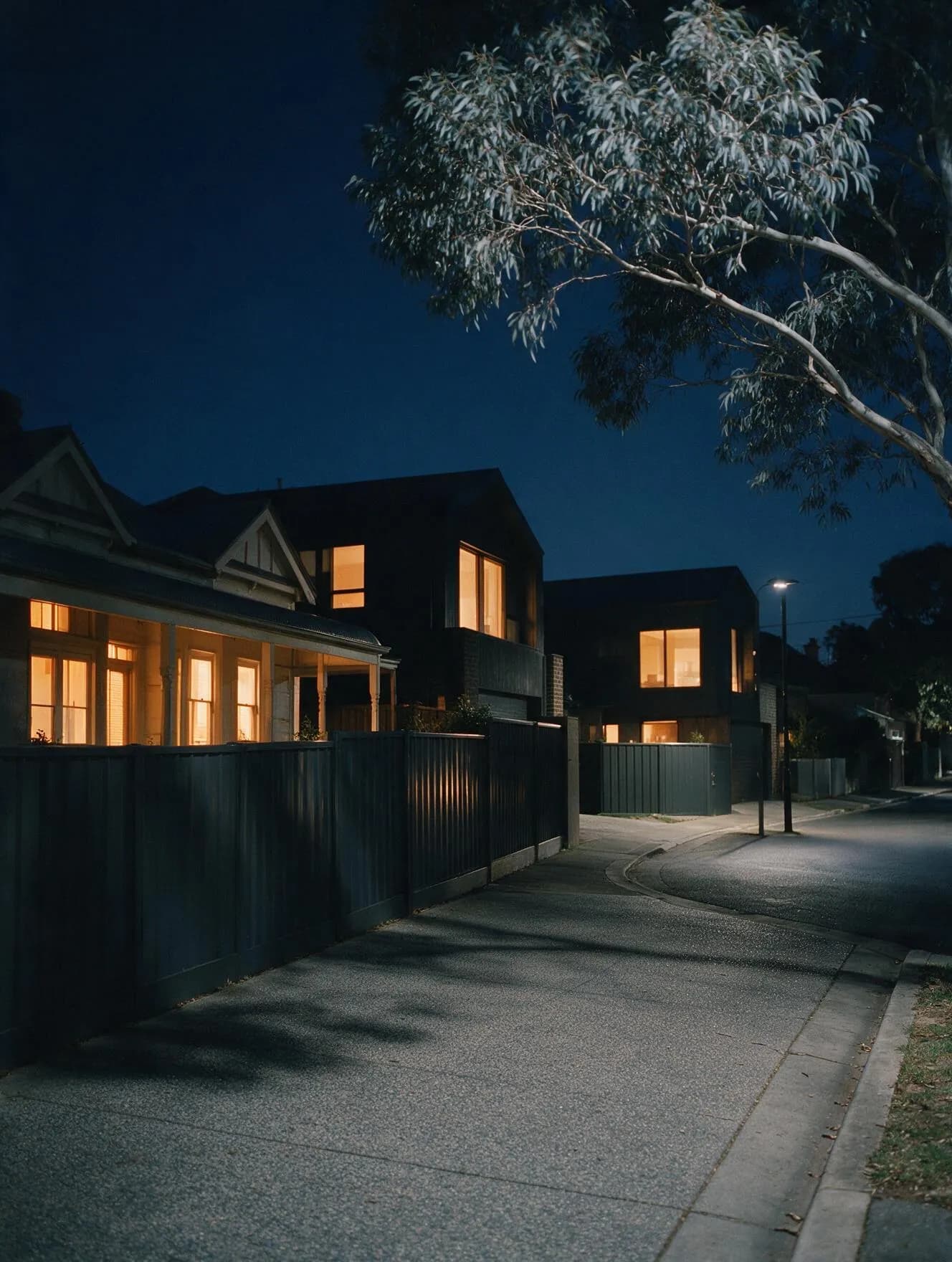 Melbourne home at dusk with tinted glazing